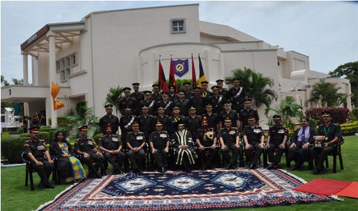 Graduating officers with dignitaries